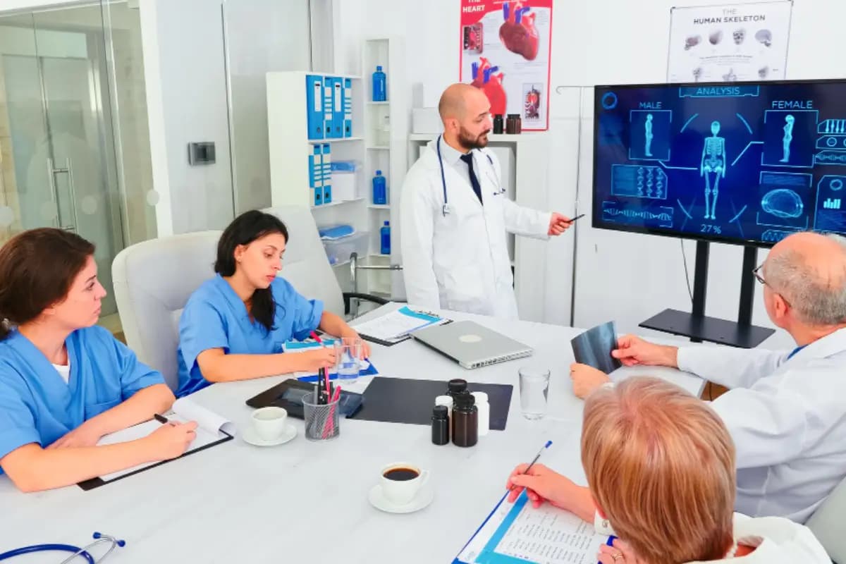Hospital team discussing digital healthcare information